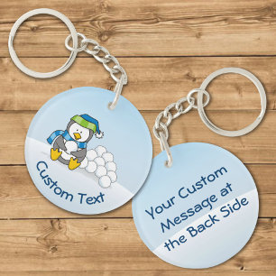 Porte-clés Petit pingouin assis avec des boules de neige Port