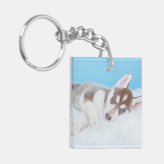 Porte-clés Petite marionnette Husky posée sur une couverture (Devant gauche)