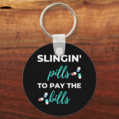 Porte-clés Pills de slingin pour payer les factures (Recto)