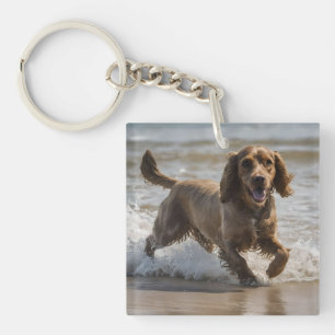 Porte-clés "Plaisir de bord de mer : Cocker Spaniel à jouer d