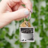 Porte-clés Plan rapproché d'un bol complètement de grains de (main)