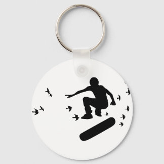 Porte-clés planche à roulettes. planche avec des oiseaux.