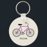 Porte-clés Porte - clé de vélos pourpre<br><div class="desc">Un porte - clé avec l'illustration d'un vélo violet. Personnalisez avec votre nom sous vélo.</div>
