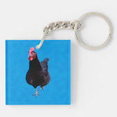 Porte-clés Poulet Noir Sur Arrière - plan Bleu Éponge, (Dos)
