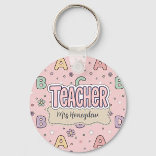 Porte-clés Professeur lettres roses motif scolaire