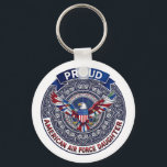 Porte-clés Proud American Air Force Daughter<br><div class="desc">This design features colorful American eagle with its wings widely spread. The eagle is located over the magic mandala and is decorated with the USA flag. The colorful text "Proud American Air Force Daughter" goes around the image. A beautiful family gift for a girl or woman. Do not forget to...</div>