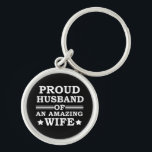 Porte-clés proud husband of an amazing wife<br><div class="desc">This original proud husband of an amazing wife graphic design with awesome typography font lettering is a great birthday and Fathers day gift idea for all appreciated, special, brave, wonderful, and one-of-a-kind fathers, husbands, and dads! The best amazing and funny holiday present for your awesome dad.This design is also fitting...</div>