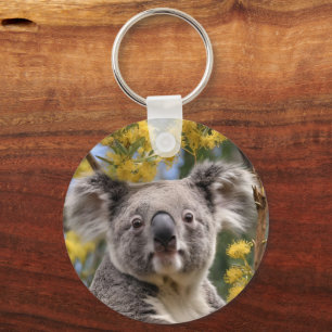 Porte-clés "Repose en or : Un Koala dans un arbre à bétail"