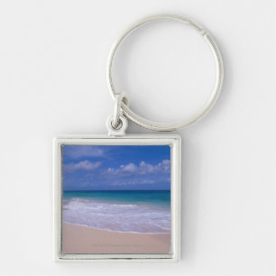 Porte-clés Ressacs écumant sur la plage sablonneuse