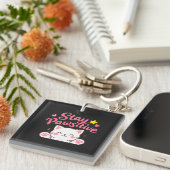 Porte-clés Restez Pawsitive – Citation Motivationnelle de Cha (Devant Droit)