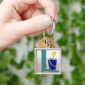 Porte-clés Seau rempli de coquillages (main)