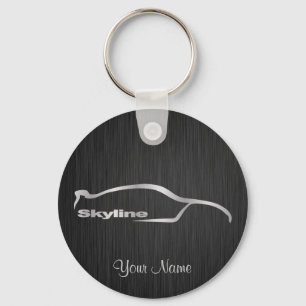 Porte-clés Silhouette argentée d'horizon avec le backg noir