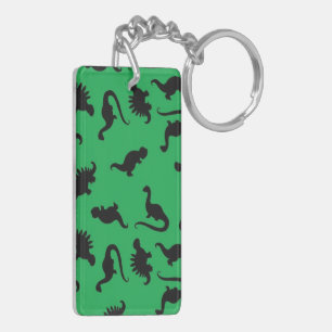 Porte-clés Silhouettes de dinosaures sur fond vert motif