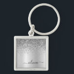 Porte-clés Silver Glitter Glam<br><div class="desc">Argent Faux Foil Parties scintillant à étincelles métalliques brossé Monogramme Nom Clés (Porte - clé). Cela rend le cadeau parfait pour 16 ans, mariage, douche nuptiale, anniversaire, baby shower ou bachelorette pour quelqu'un qui aime le luxe glam et les styles chic.</div>