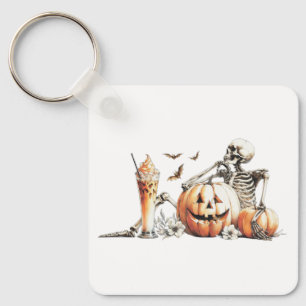 Porte-clés Squelette avec citrouille et boire. Halloween.