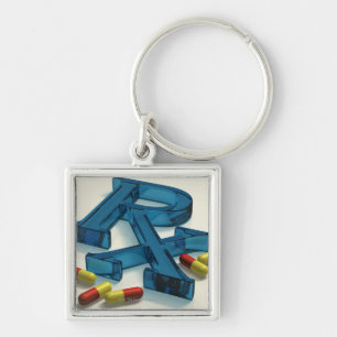 Porte-clés symbole de 3D RX avec des capsules