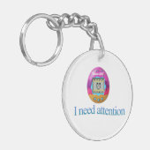 Porte-clés Tamagotchi "J'ai besoin d'attention" (Devant gauche)