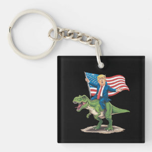 Porte-clés Trump à cheval sur un dinosaure T Rex drapeau amér