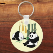 Porte-clés Two Cute Pandas eat bamboo in tropical forest (Recto)
