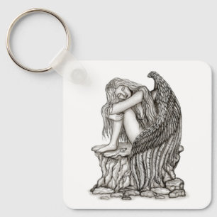 Porte-clés Un ange endormi sur la pierre
