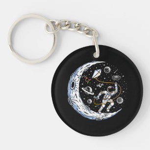 Porte-clés Un astronaute pilote un cerf-volant sur la lune