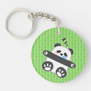 Porte-clés Un bébé panda mignon dormant paisiblement