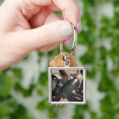 Porte-clés Un chef d'équipe indique un délai (main)