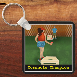 Porte-clés Un couple amusant joue à un jeu de Cornhole   Cha