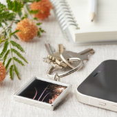 Porte-clés Un feu d'artifice illumine le mémorial de la Force (Côté)