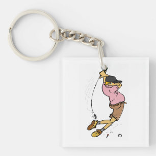 Porte-clés Un golfeur manque la balle