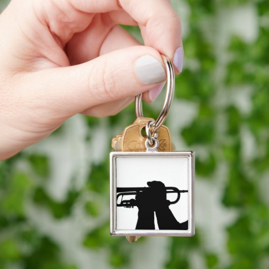 Porte-clés Un membre de service joue une chanson (main)