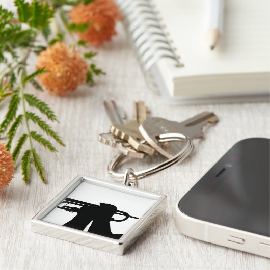 Porte-clés Un membre de service joue une chanson (Côté)