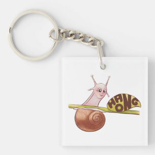 Porte-clés Un mignon escargot de dessin sur un Plante avec un