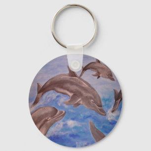 Porte-clés Un morceau de dauphins de saut
