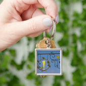 Porte-clés Un panneau en fer forgé qui illustre le thème (main)