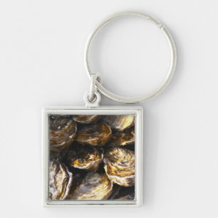 Porte-clés Une assiette d'huîtres.