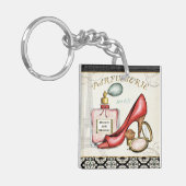 Porte-clés Une chaussure rouge, une bouteille de parfum, et (Devant gauche)