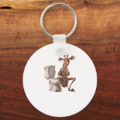 Porte-clés Une Mignonne Girafe En Pyjamas Assis Sur Des Toile (Recto)