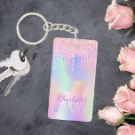 Porte-clés Unicorn rose parties scintillant gouttes nom holog<br><div class="desc">Un arrière - plan holographique branché aux couleurs unicorne et pastel rose,  violet,  vert menthe. Décoré avec des gouttes de parties scintillant,  la peinture goutte à goutte. Personnalisez et ajoutez votre nom. Lettres violettes. Un peu de glamour quotidien pour égayer votre journée !</div>