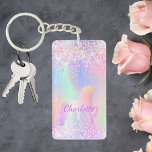 Porte-clés Unicorn rose violet nom holographique<br><div class="desc">Un arrière - plan holographique branché aux couleurs unicorne et pastel rose,  violet,  vert menthe. Décoré de faux parties scintillant. Personnalisez et ajoutez votre nom. Lettres violettes. Un peu de glamour quotidien pour égayer votre journée !</div>