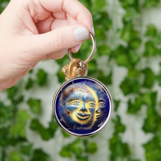 Porte-clés visage soleil foncé/visage lune (Main)