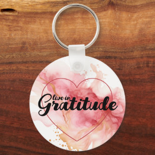 Porte-clés Vivez dans la gratitude encre rose