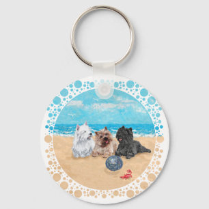 Porte-clés Westie avec des terriers Cairn à la plage