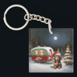 Porte-clés Winter Dachshund Caravan Christmas Adventure<br><div class="desc">Laissez-vous tenter par la magie d'une nuit d'hiver enneigée alors qu'une caravane glisse gracieusement à travers le paysage illuminé par la lune. La beauté sereine de la neige scintillante et l'éclat enchanteur de la lune créent une scène captivante, promettant une aventure de Noël inoubliable remplie de chaleur, de joie et...</div>