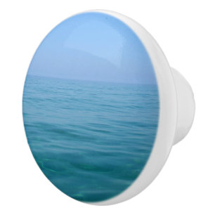 Porte En Céramique Bouton bleu simple de raboteuse de mer et de ciel