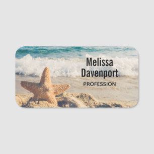 Porte-nom Starfish sur une plage de sable Photo