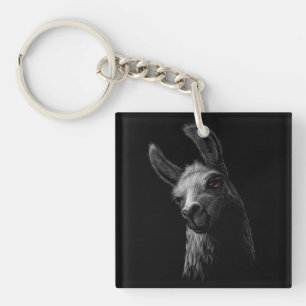 Portret Head Cute Llama met een zwarte achtergrond Sleutelhanger