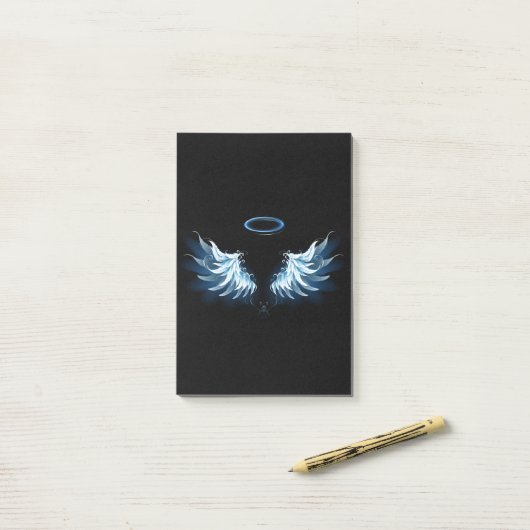 Post-it® Blue Glowing Angel Wings on black background (Sur un bureau)