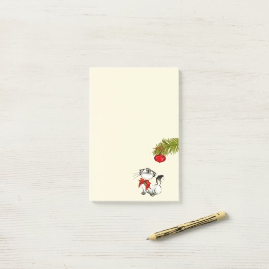 Post-it® Chat Kitty En Jeu Dans Une Bow De Noël Rouge (Sur un bureau)