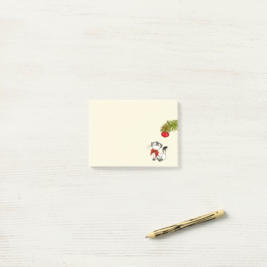 Post-it® Chat Kitty En Jeu Dans Une Bow De Noël Rouge (Sur un bureau)